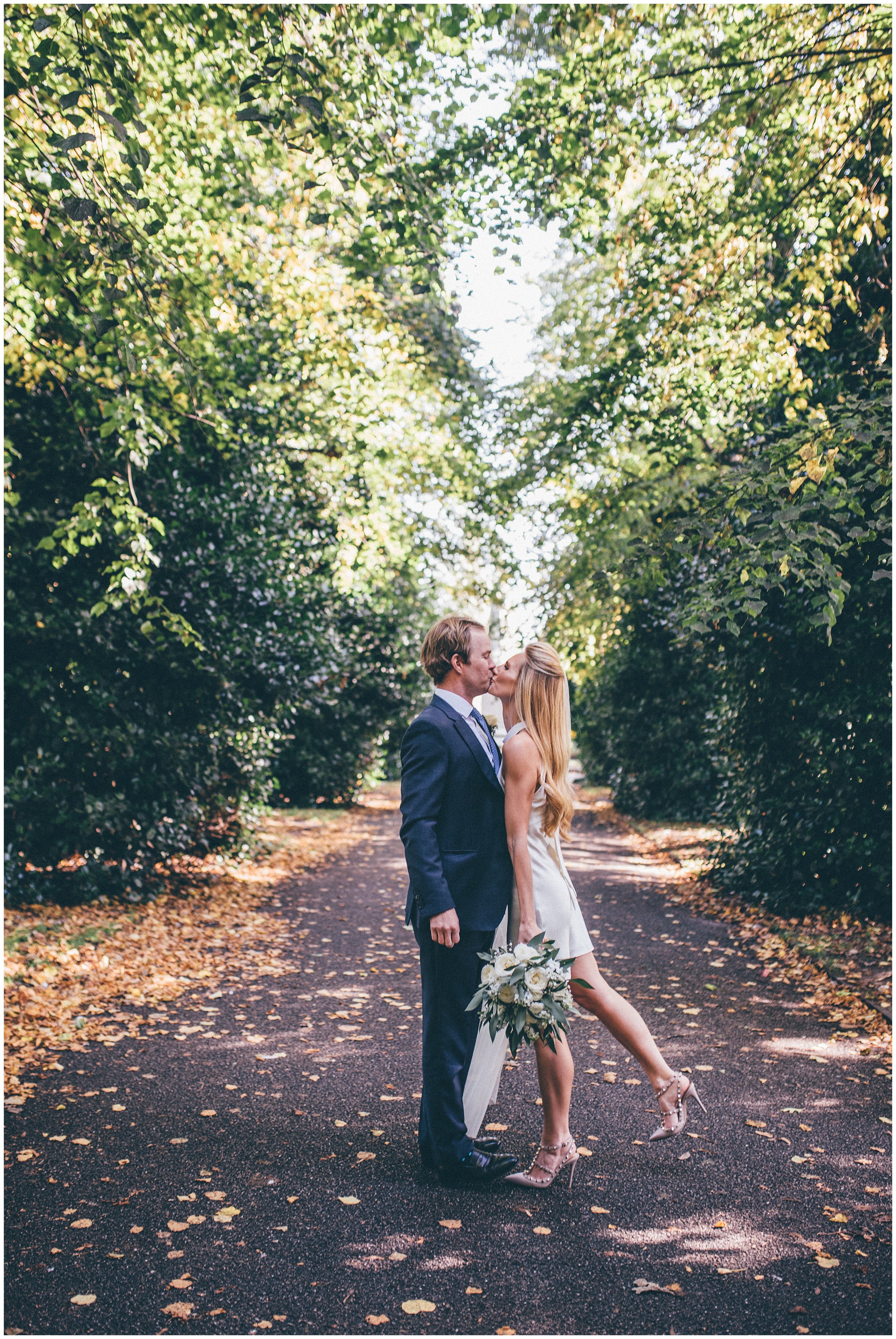 Bride and groom have their wedding photographs in the park in Chester