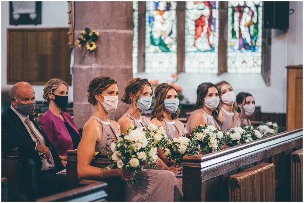 Bridesmaids all wear masks during the wedding ceremony in Cheshire