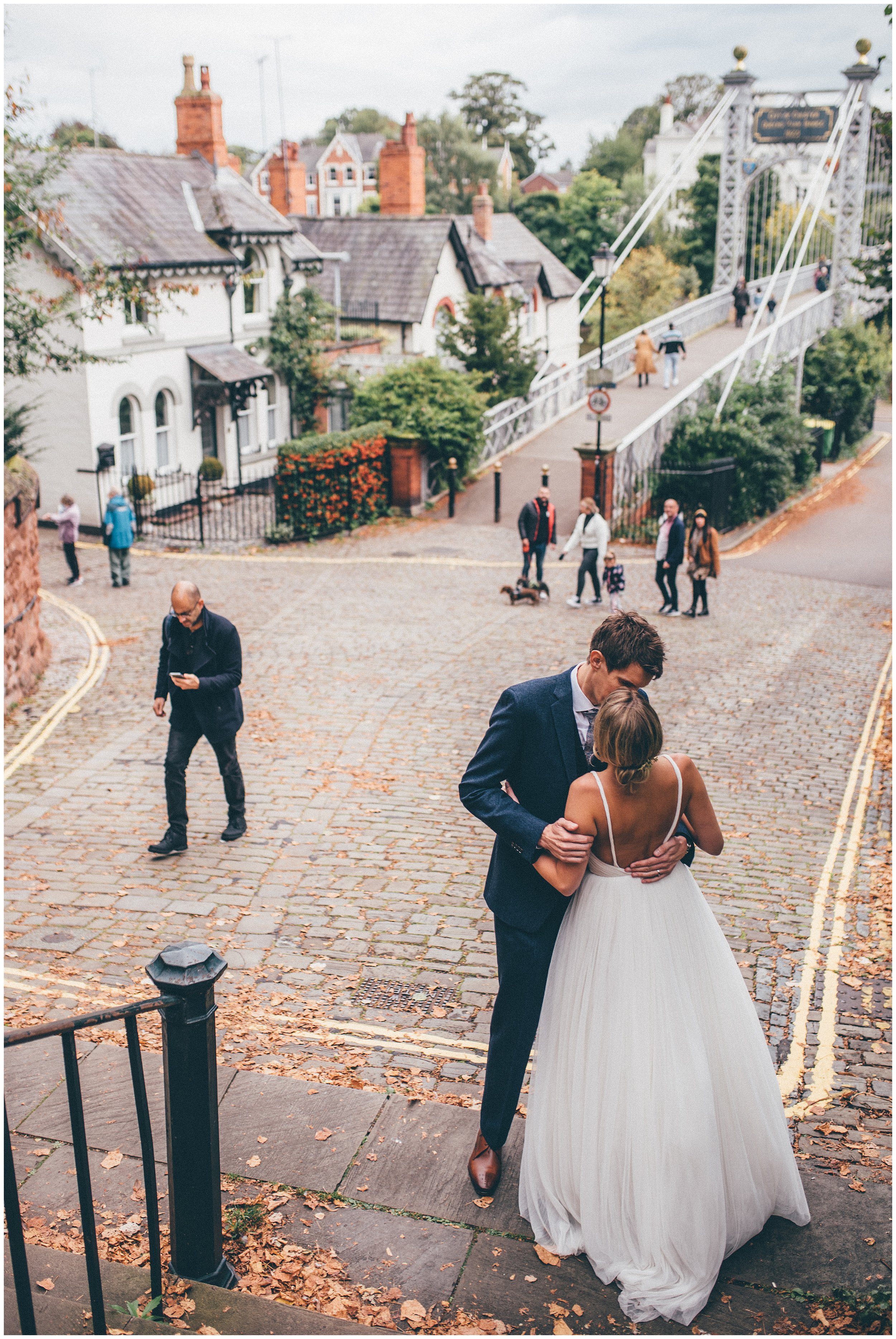 Bride and groom kiss in Chester city centre