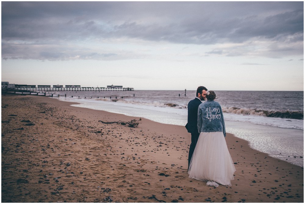 Bride and Groom stand on Southwold beach
