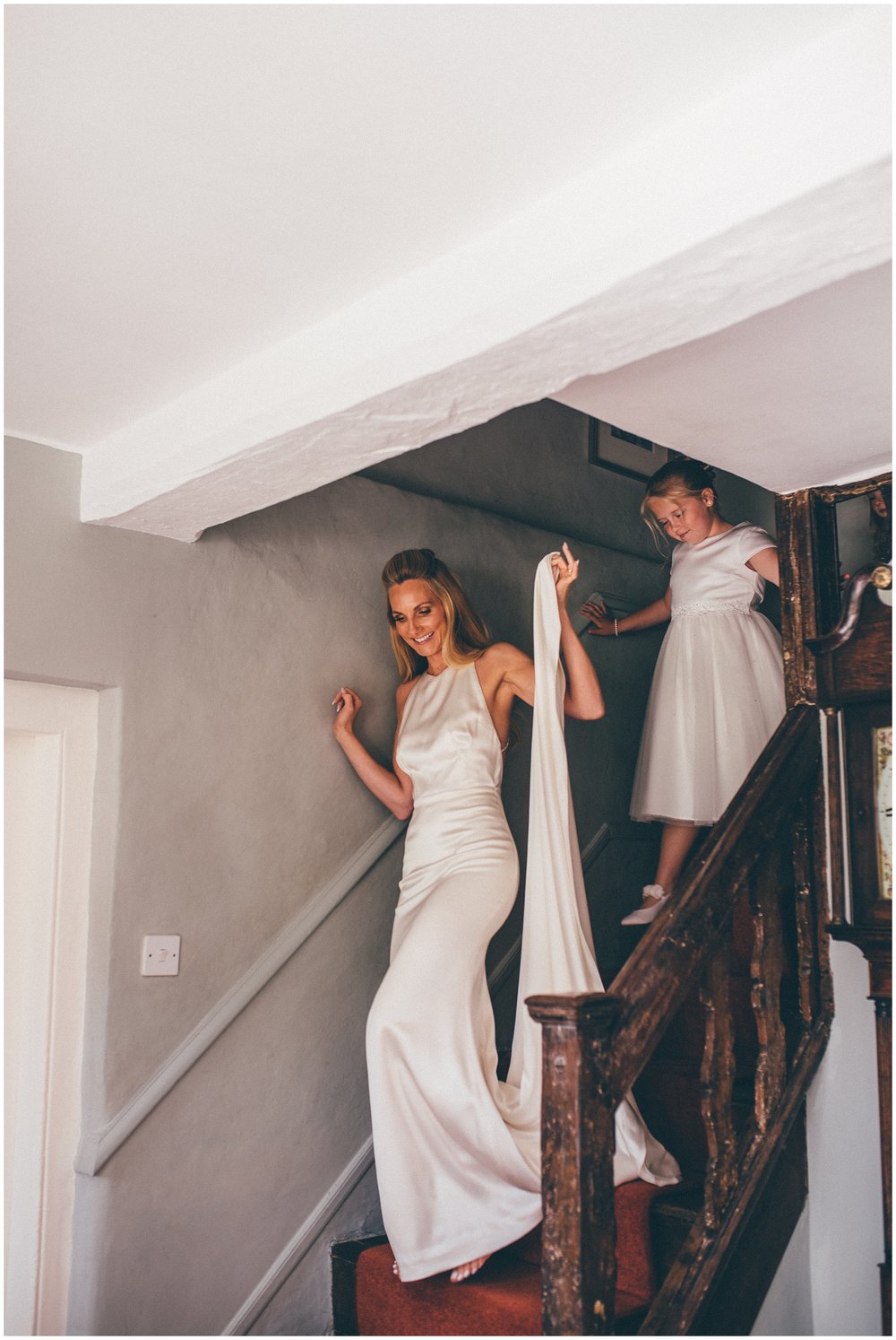 Stunning bride walks down the stairs 