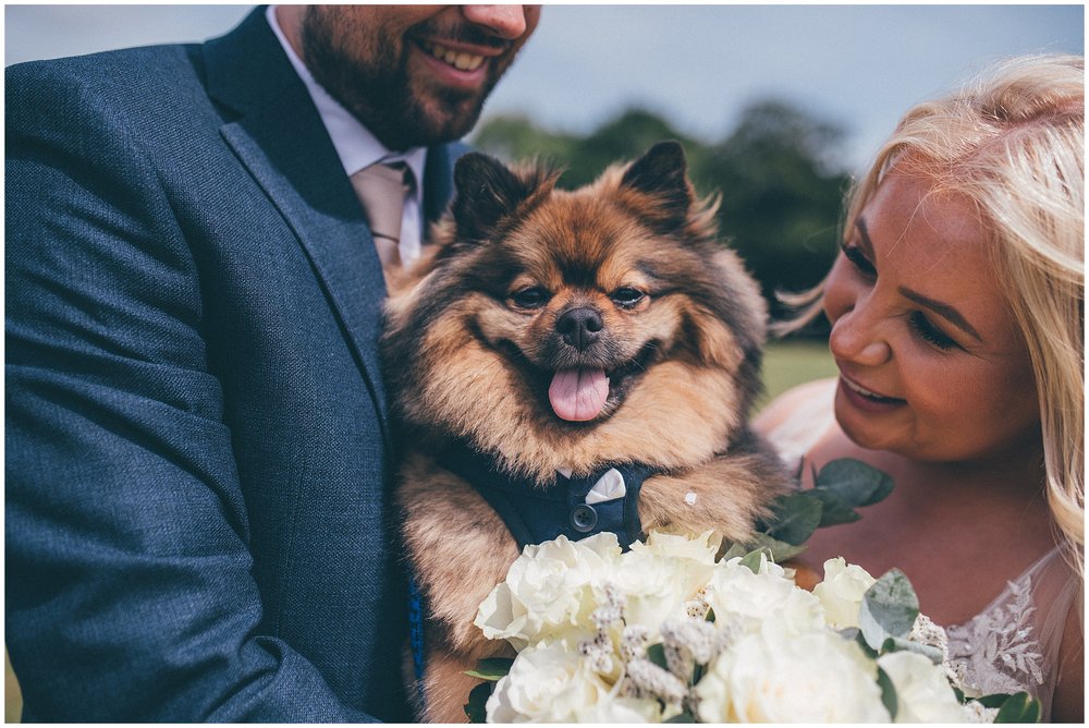 Bride and groom with their dog Gizmo at Liverpool cricket club wedding