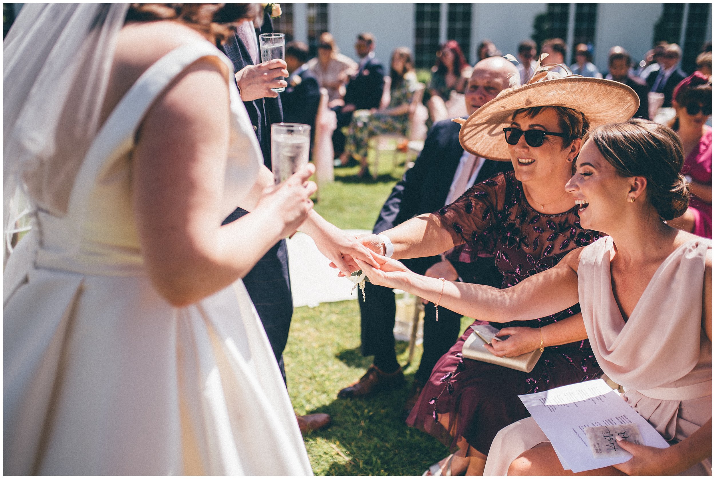 Wedding guests admire ride's wedding ring at Rowton Hall in Cheshire