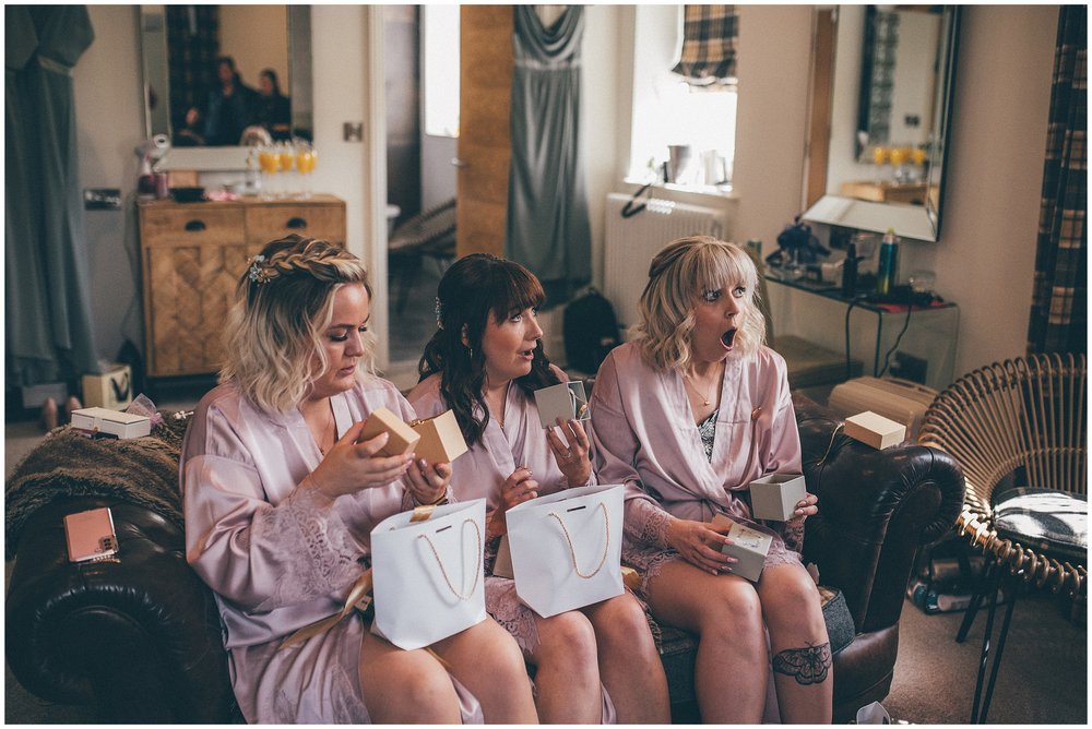 Bridesmaids receive gifts from the bride at Holmes Mill