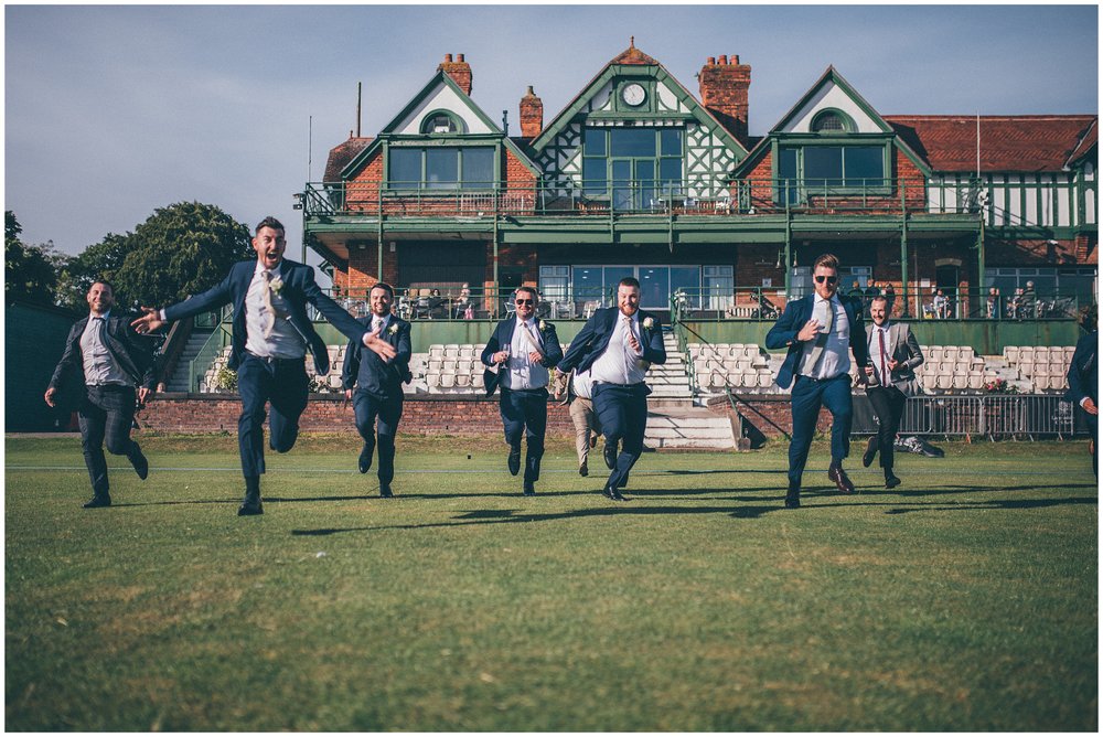 Groomsmen all have a running race at Liverpool Wedding