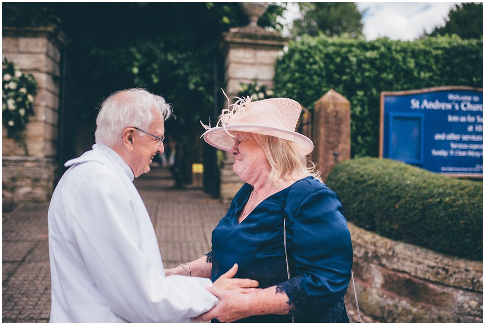 Vicar consoles the emotional mother of the bride at Cheshire wedding