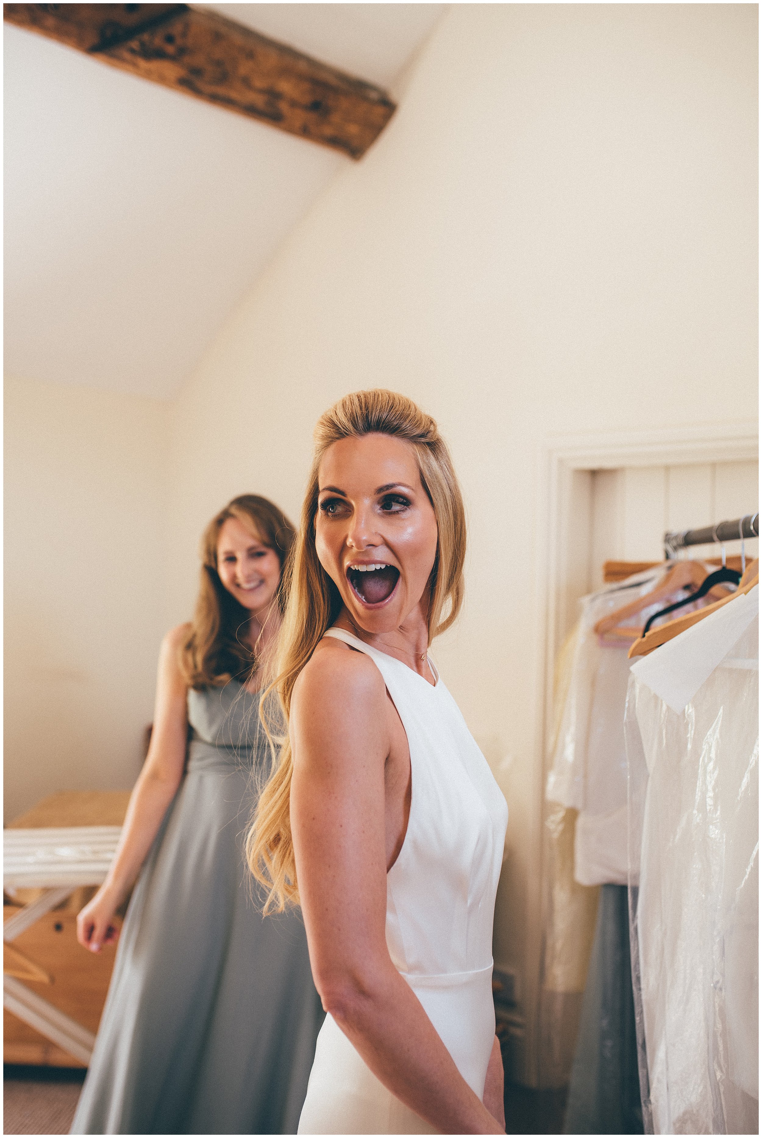Bride is very excited seeing her reflection for the first time in Cheshire