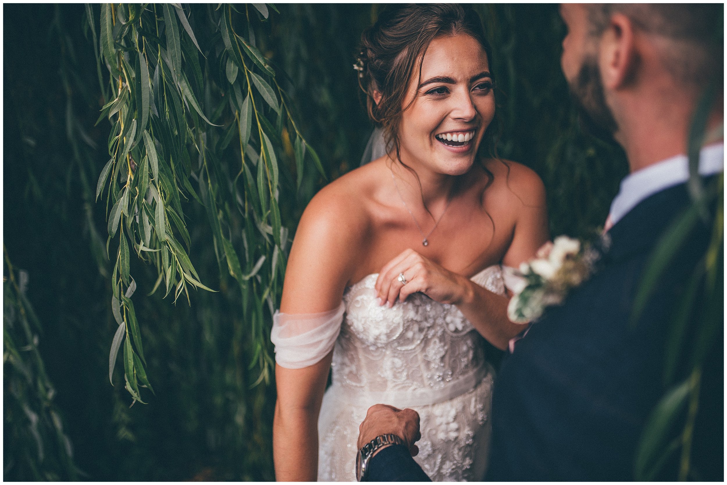 Bride and groom beneath the willow at Skipbridge country wedding venue