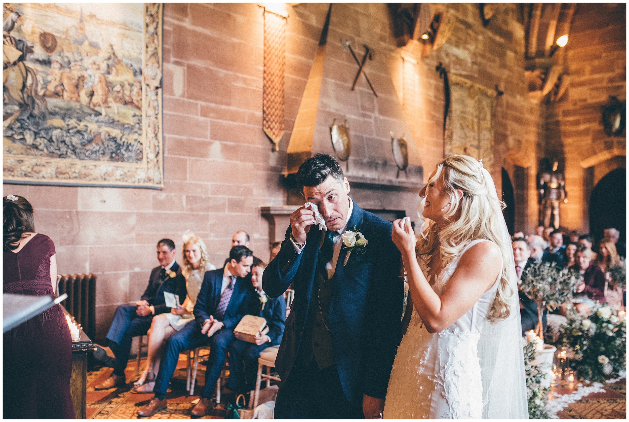 Groom cries during their wedding ceremony at Peckforton Castle