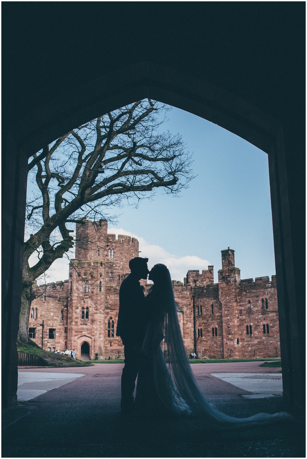 Silhouette of bride and groom at their Peckforton Castle wedding