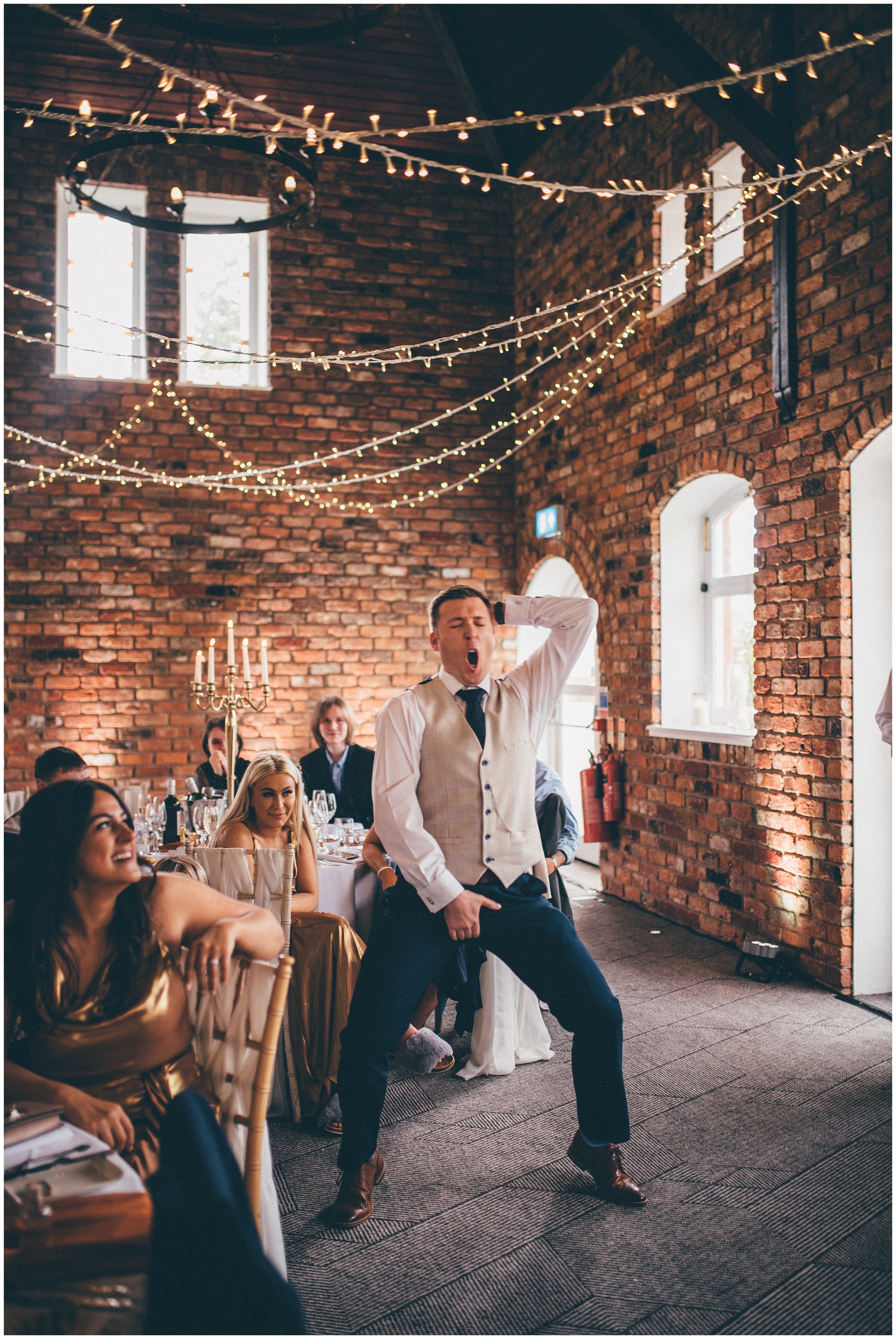 Groomsmen dances during speeches at Doubletree by Hilton in Chester