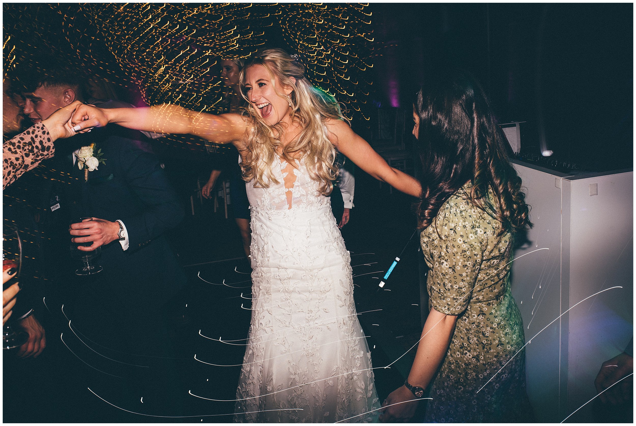 Bride dances with her wedding guests at Peckforton Castle