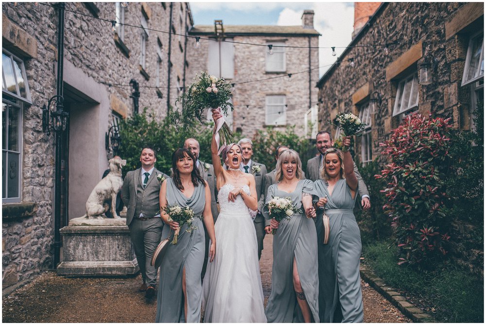 Bridal party dance together at Holmes Mill wedding venue in Clitheroe