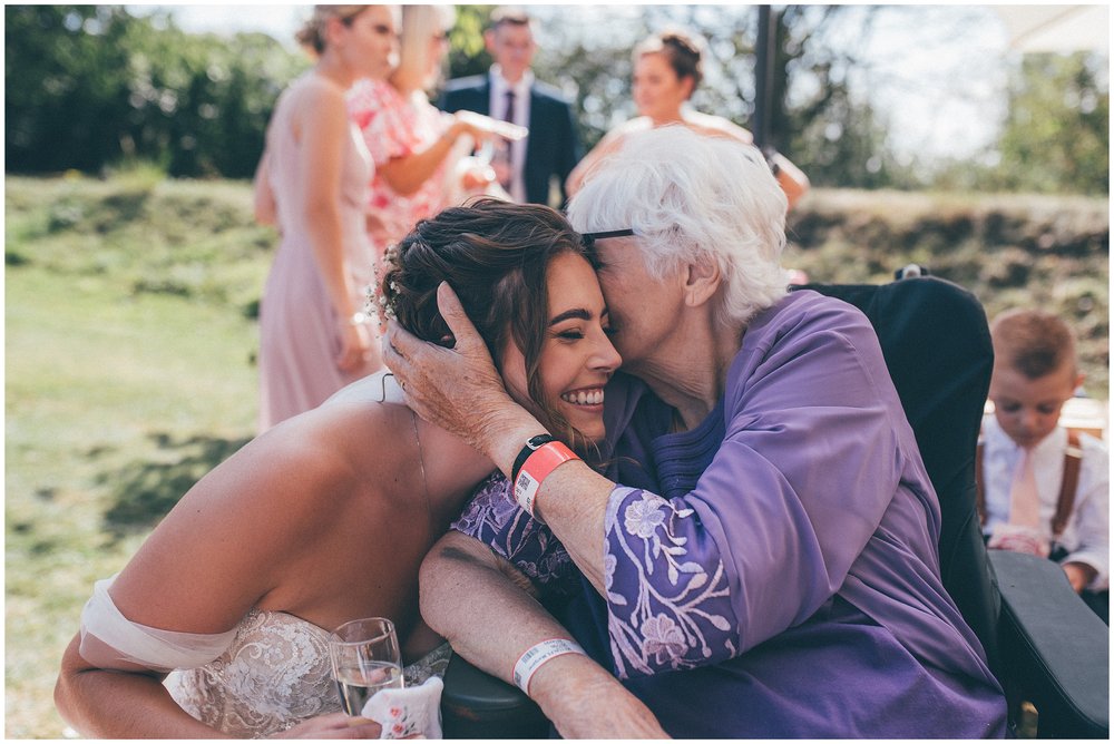 Bride's grandma kisses her at Skipbridge country wedding