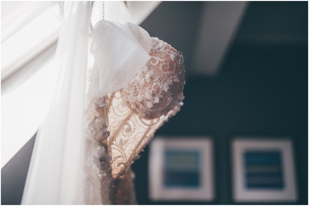 Wedding dress hung up at Aldwark Manor in York