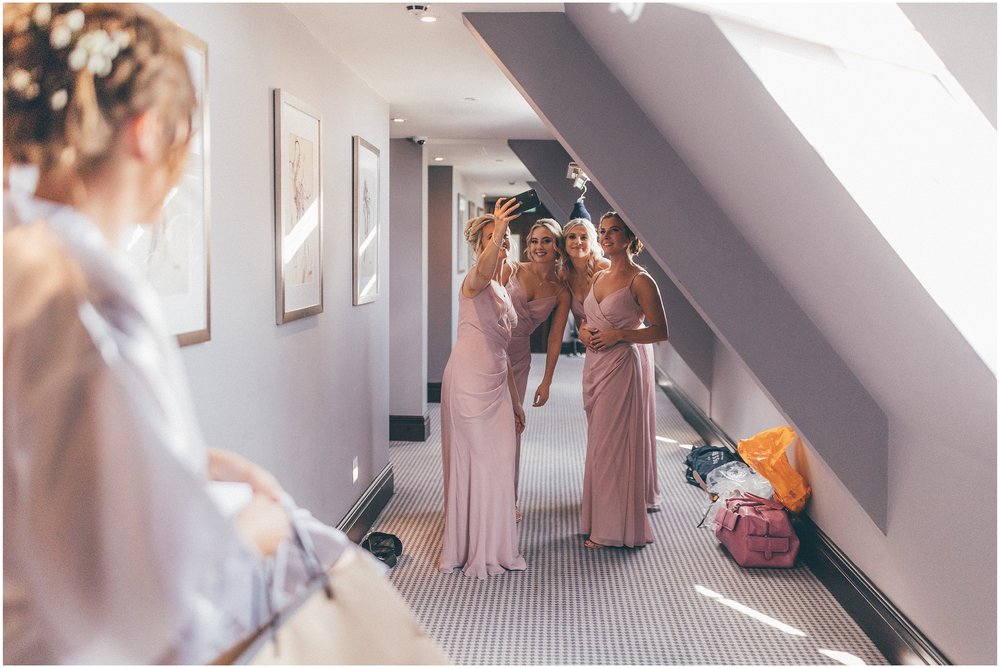 Bridesmaids take a selfie before the wedding at Aldwark Manor in York