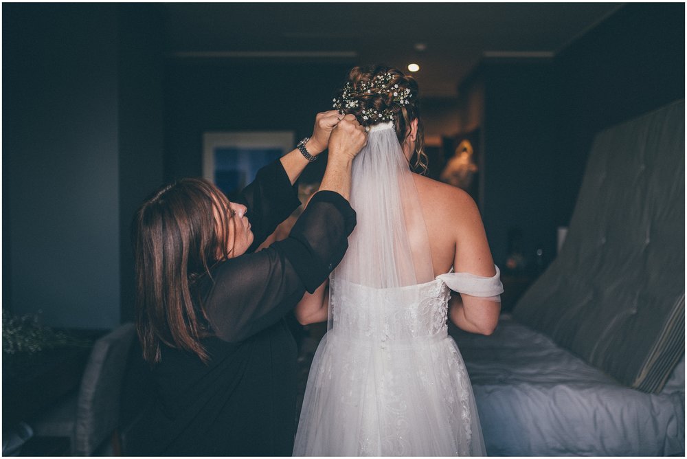 Hairdresser puts the bride's veil in at Aldwark Manor in York