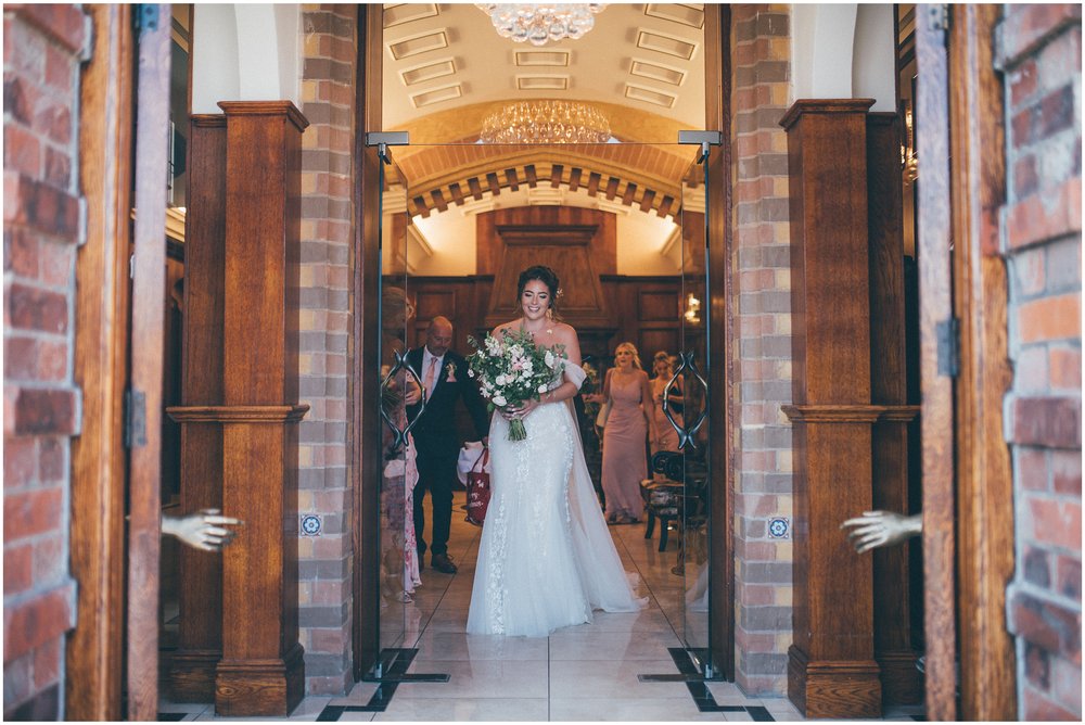 Bride leaves Aldwark Manor in York before her wedding at Skipbridge Country Weddings in Yorkshire