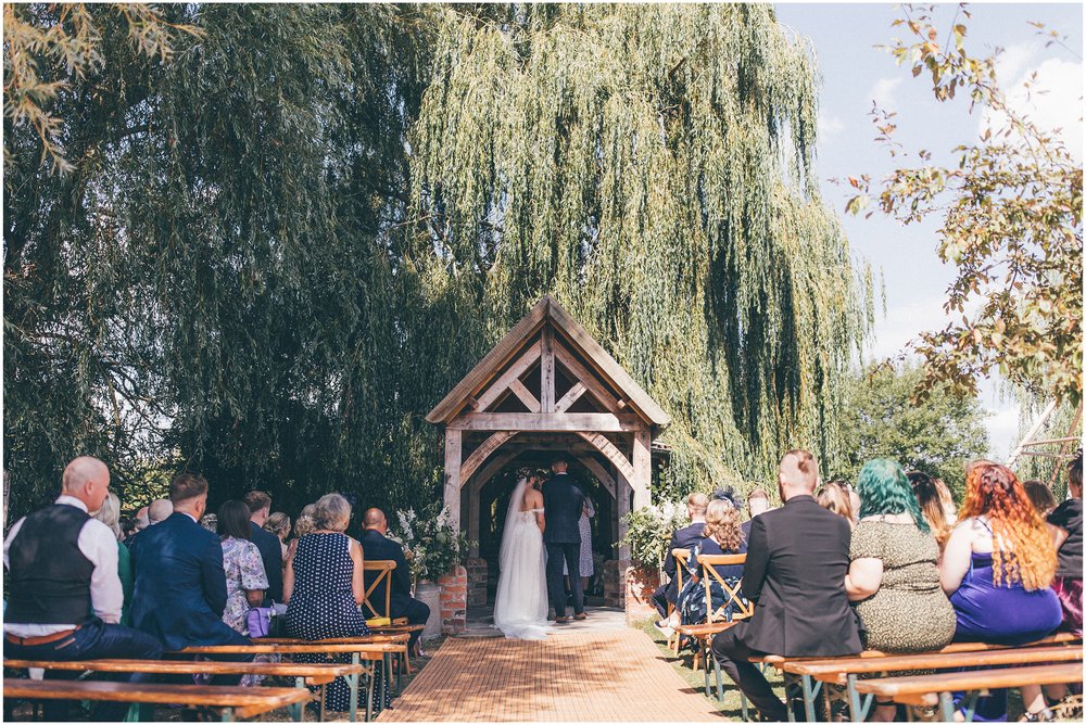Bride and groom have their outdoor wedding ceremony at Skipbridge Country Wedding venue in Yorkshire