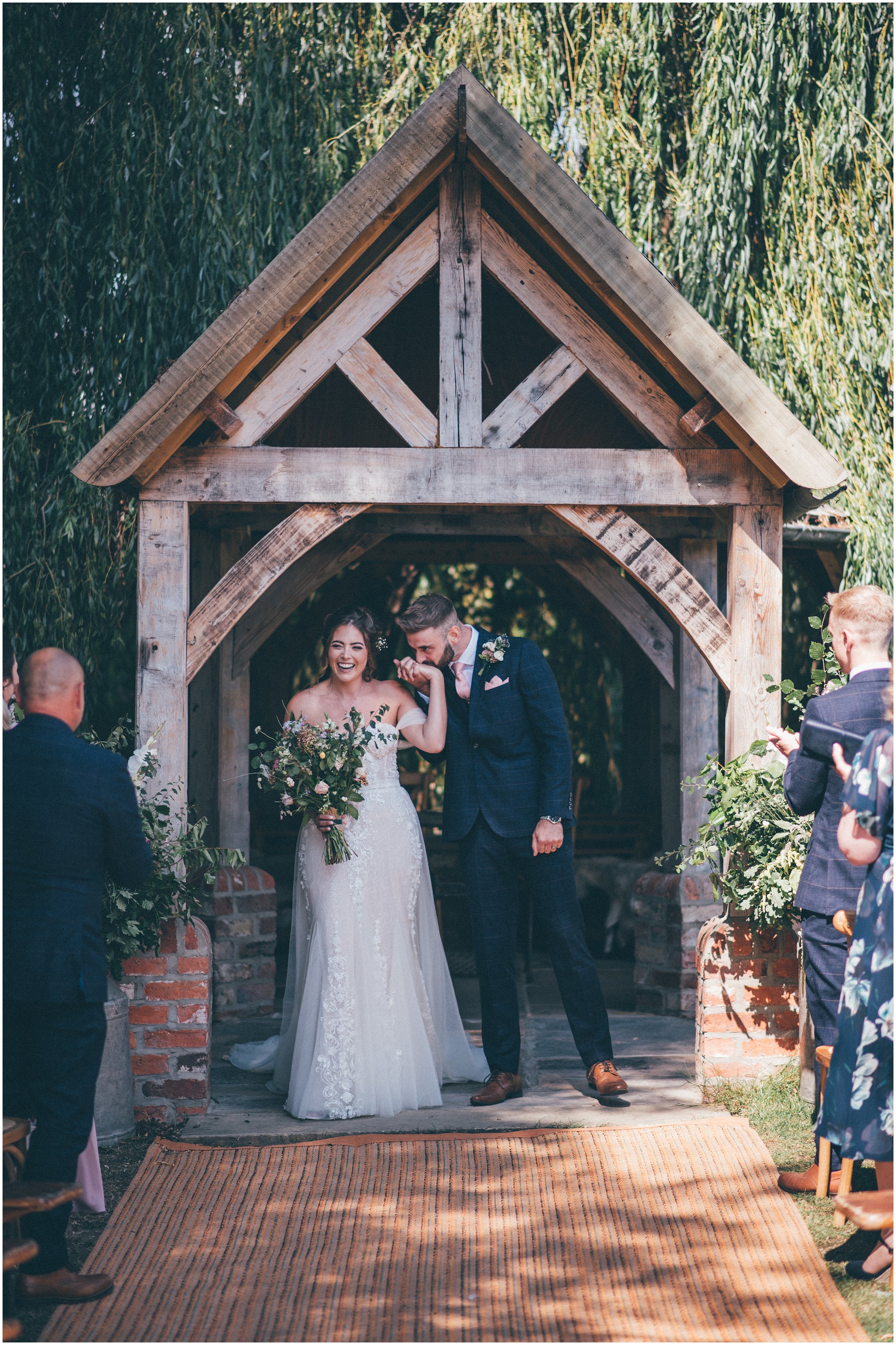 Bride and groom have their outdoor wedding ceremony at Skipbridge Country Wedding venue in Yorkshire