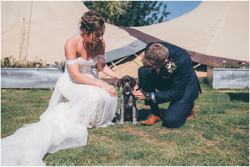 Bride and groom with their puppy at Skipbridge Country Wedding venue in Yorkshire