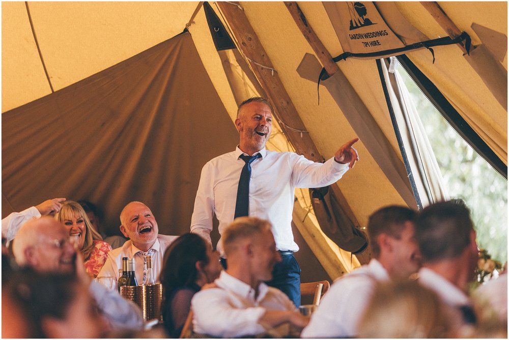 Wedding speeches in the tipi at a summer wedding at Skipbridge Country Wedding venue in Yorkshire