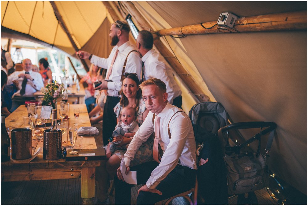 Wedding speeches in the tipi at a summer wedding at Skipbridge Country Wedding venue in Yorkshire