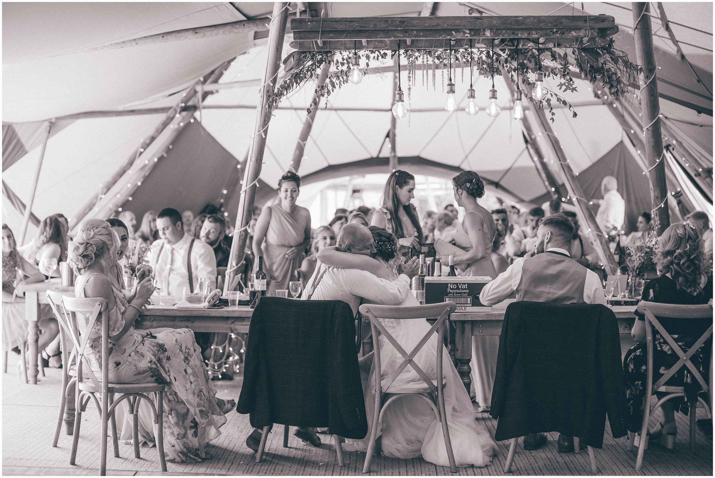 Wedding speeches in the tipi at a summer wedding at Skipbridge Country Wedding venue in Yorkshire