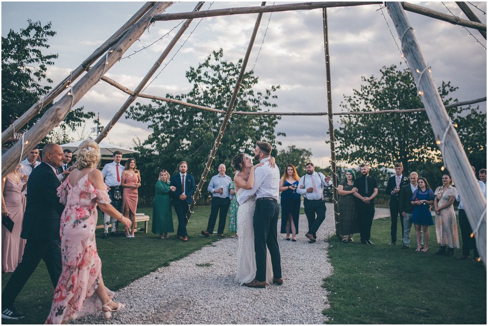 Bride and groom have their first dance outside at Skipbridge Country wedding venue in Yorkshire