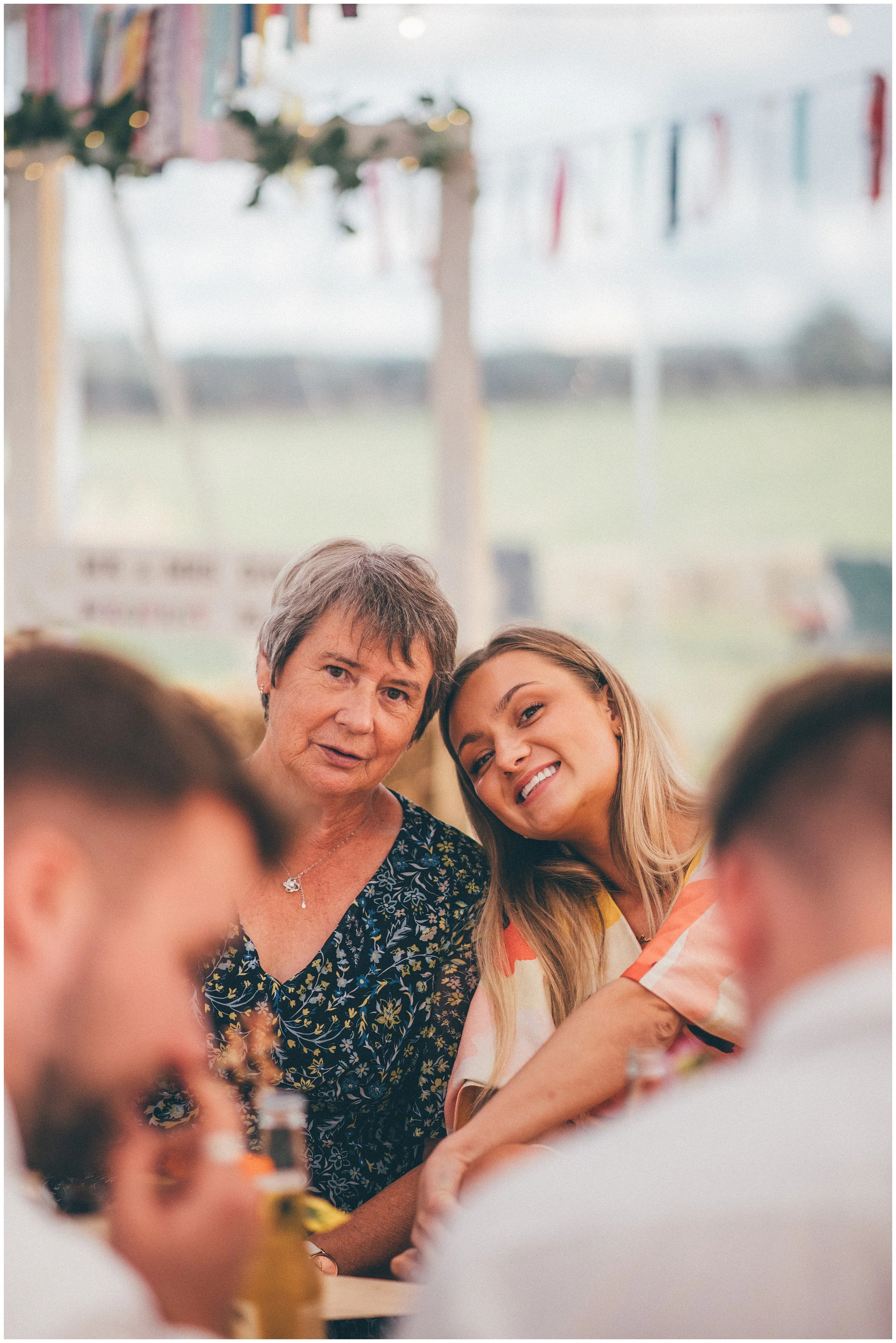 Cheshire Wedding photographer photographs garden sailcloth tent DIY wedding.