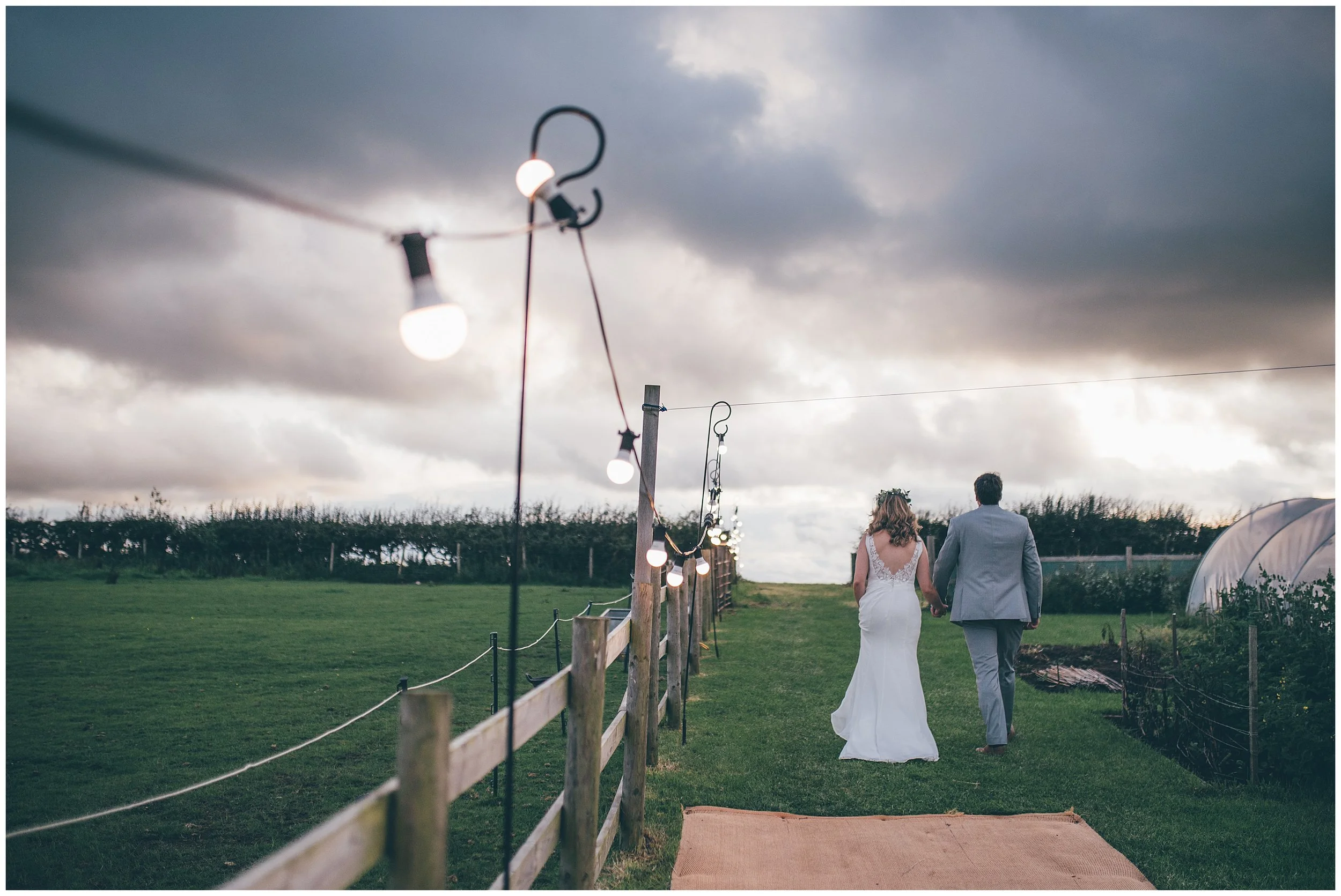 Cheshire Wedding photographer photographs garden sailcloth tent DIY wedding.