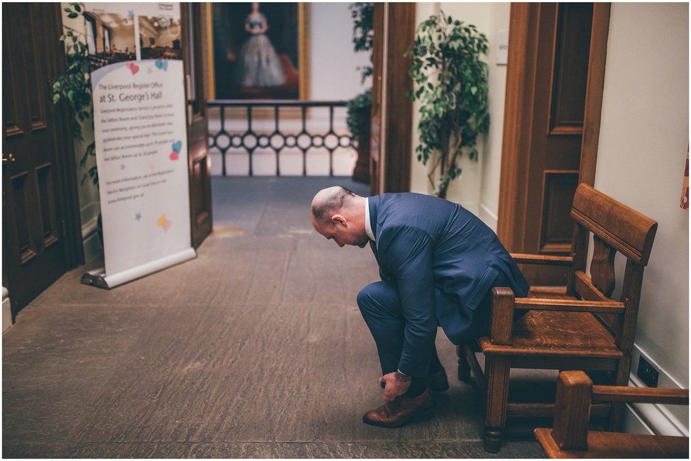 Groom ties his laces ahead of his weddingBride and Groom elope in Liverpool city centre at St George's Hall in Liverpool