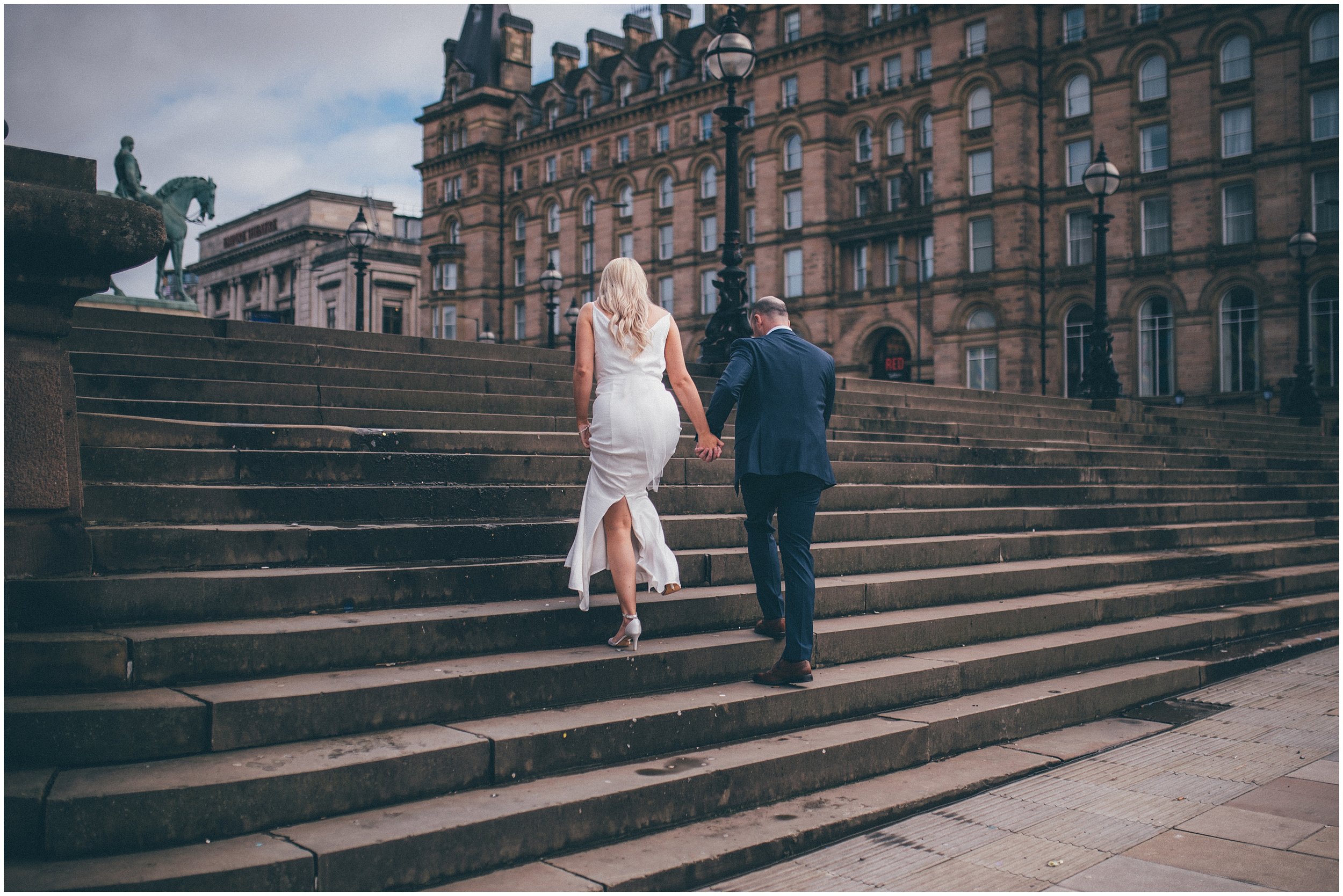 Bride and groom have their wedding portraits taken after their elopement Bride and groom get married in their elopement Bride and Groom elope in Liverpool city centre at St George's Hall in Liverpool