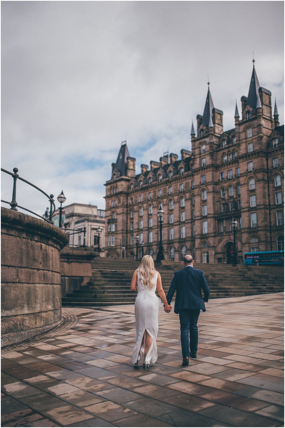 Bride and groom have their wedding portraits taken after their elopement Bride and groom get married in their elopement Bride and Groom elope in Liverpool city centre at St George's Hall in Liverpool