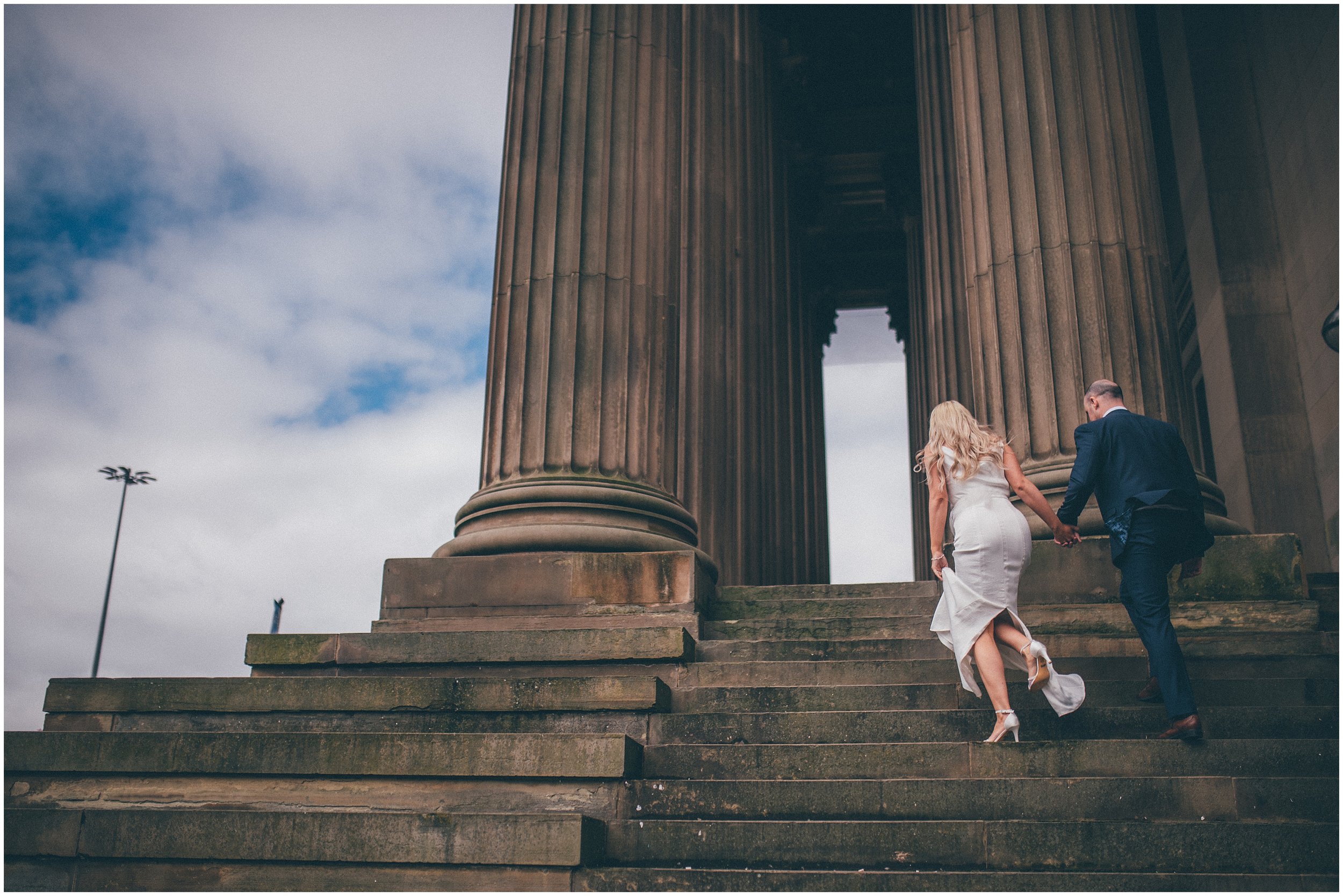 Bride and groom have their wedding portraits taken after their elopement Bride and groom get married in their elopement Bride and Groom elope in Liverpool city centre at St George's Hall in Liverpool