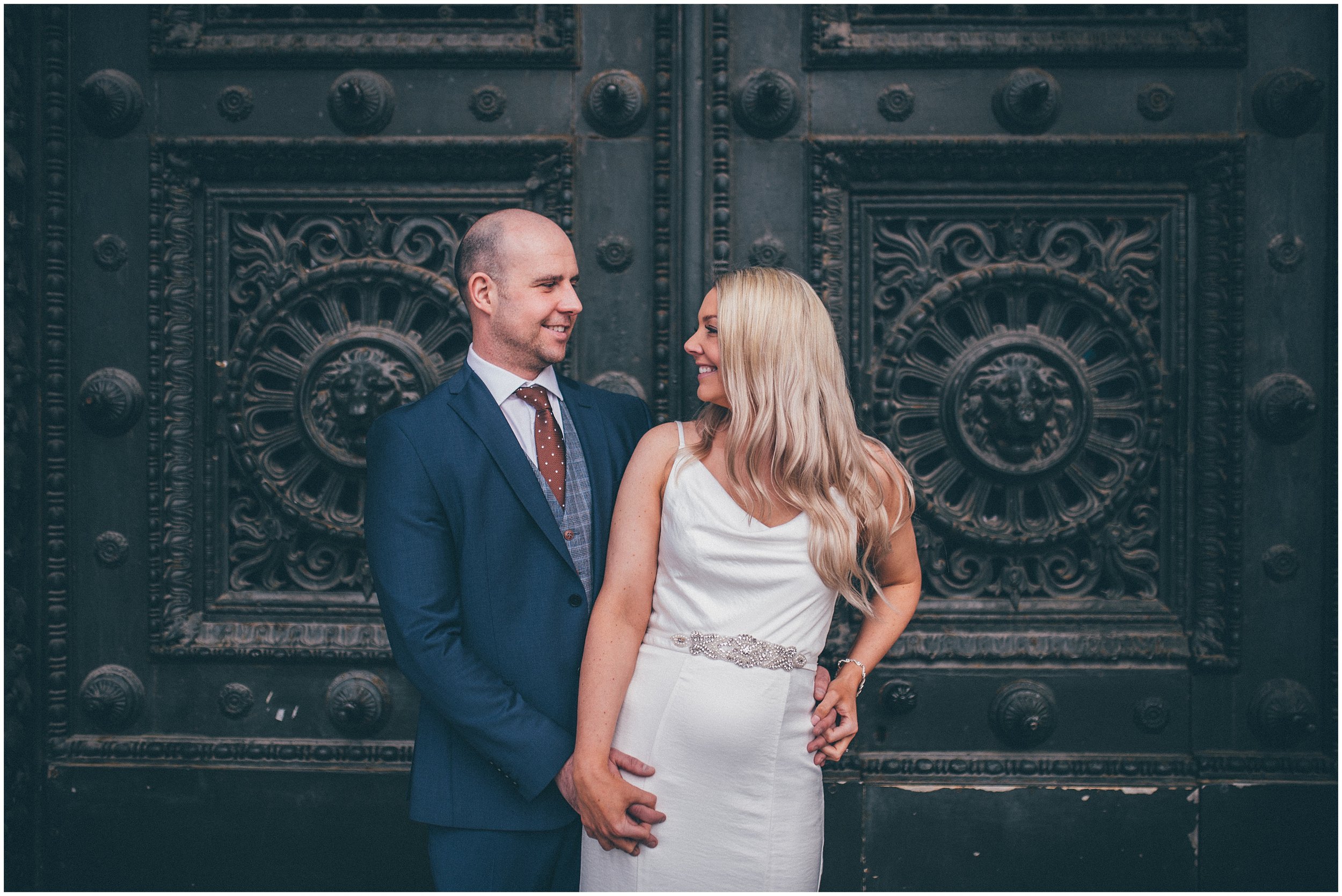 Bride and groom have their wedding portraits taken after their elopement Bride and groom get married in their elopement Bride and Groom elope in Liverpool city centre at St George's Hall in Liverpool