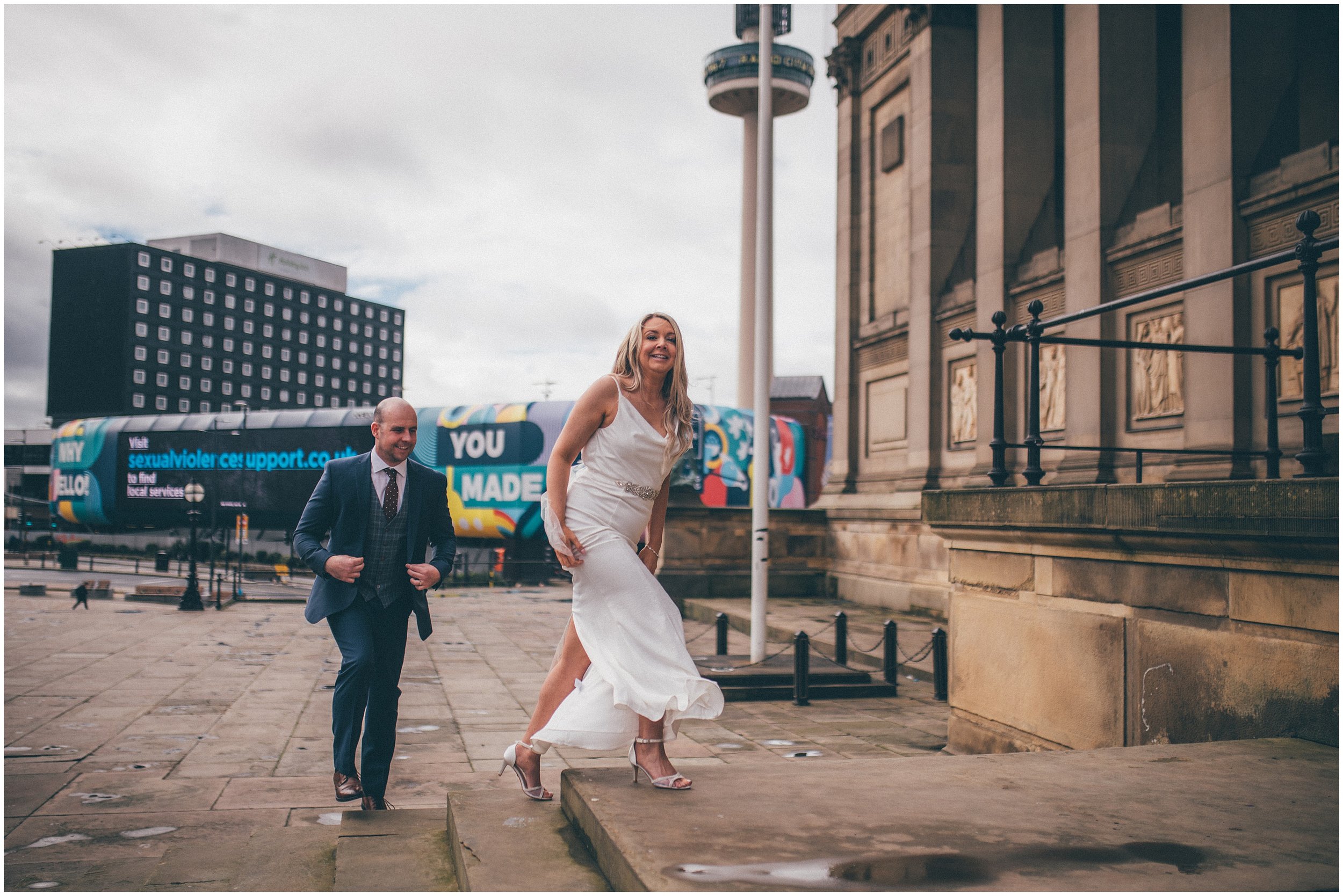 Bride and groom have their wedding portraits taken after their elopement Bride and groom get married in their elopement Bride and Groom elope in Liverpool city centre at St George's Hall in Liverpool