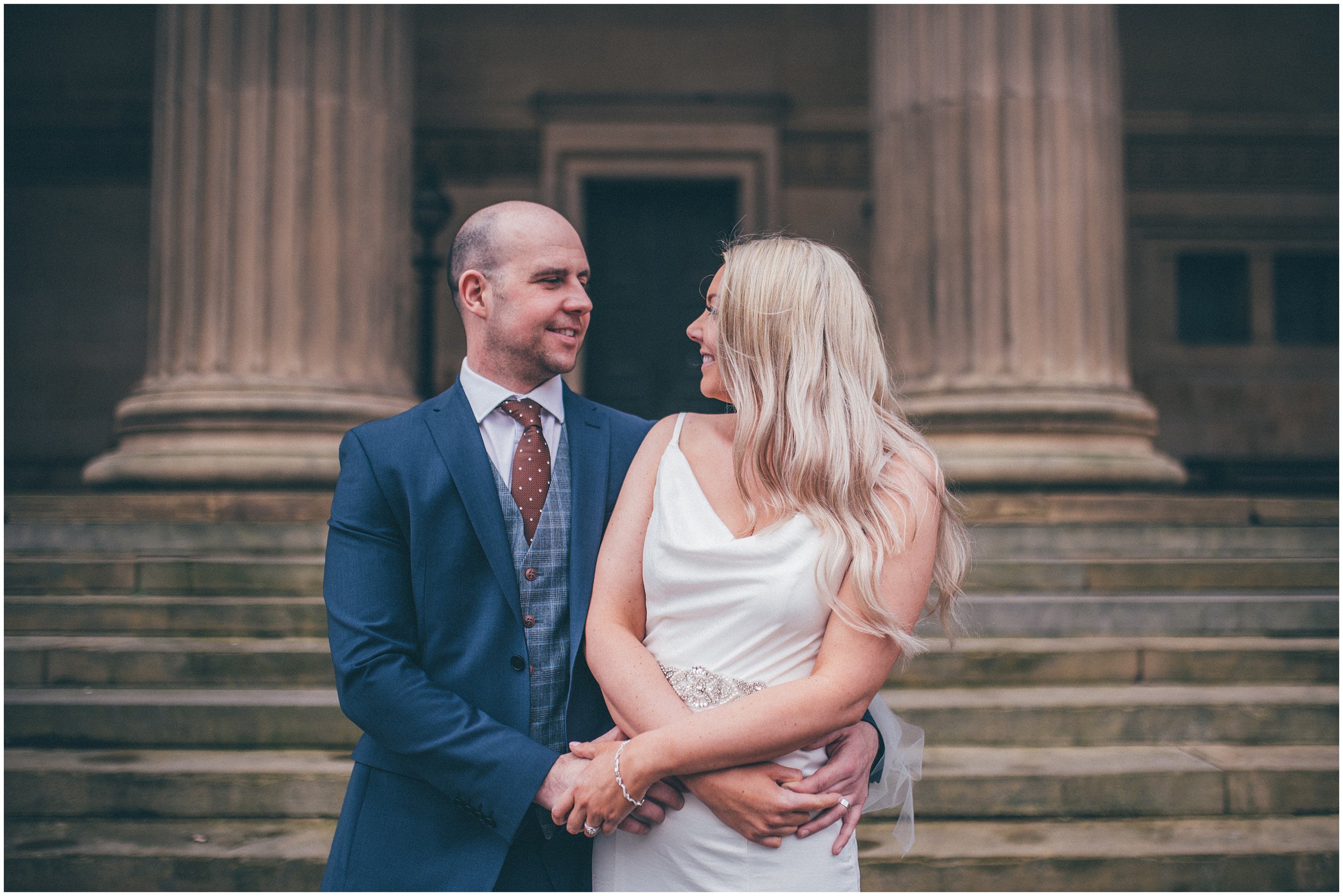 Bride and groom have their wedding portraits taken after their elopement Bride and groom get married in their elopement Bride and Groom elope in Liverpool city centre at St George's Hall in Liverpool