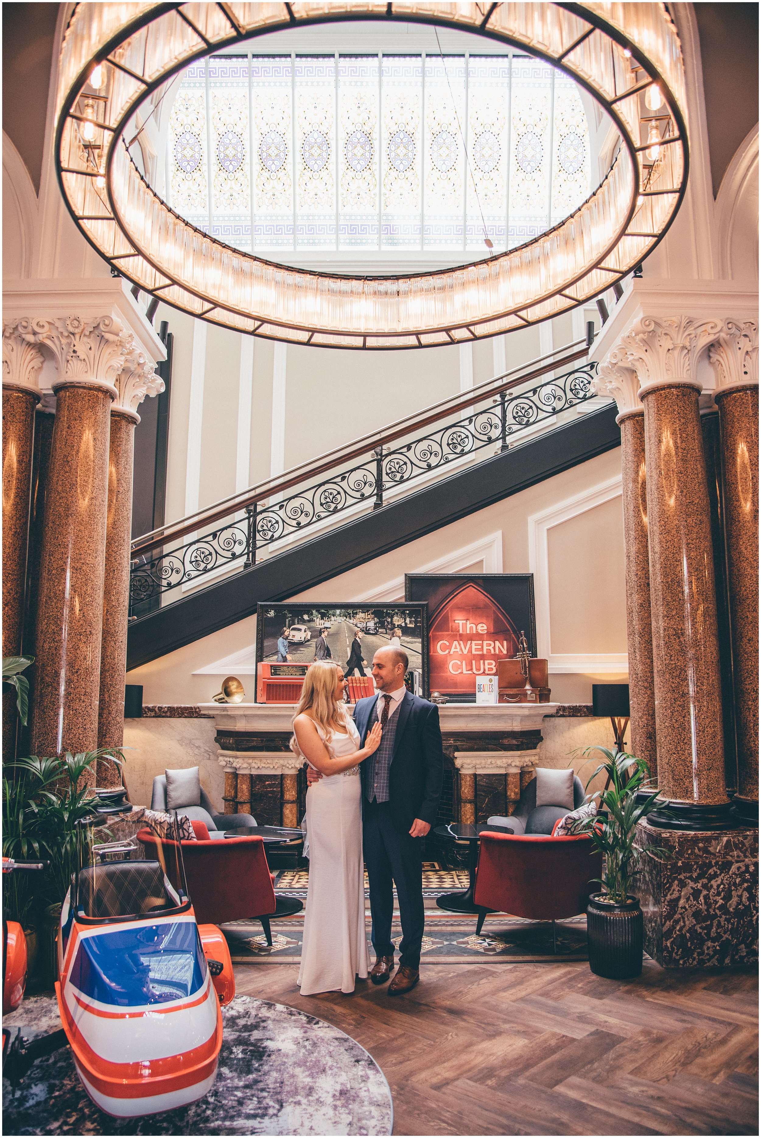 Bride and groom have wedding Photographs taken in Radisson Red after their elopement at St George's Hall in Liverpool City Centre