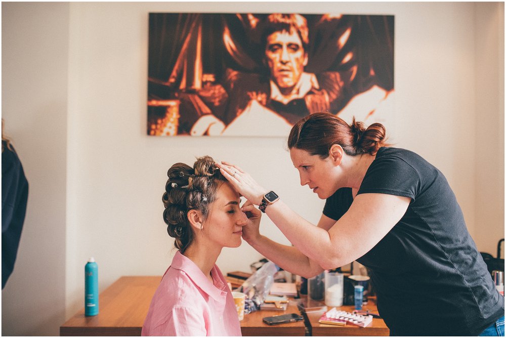 Bride gets her make-up done ahead of her wedding at Sefton Palm House in Liverpool