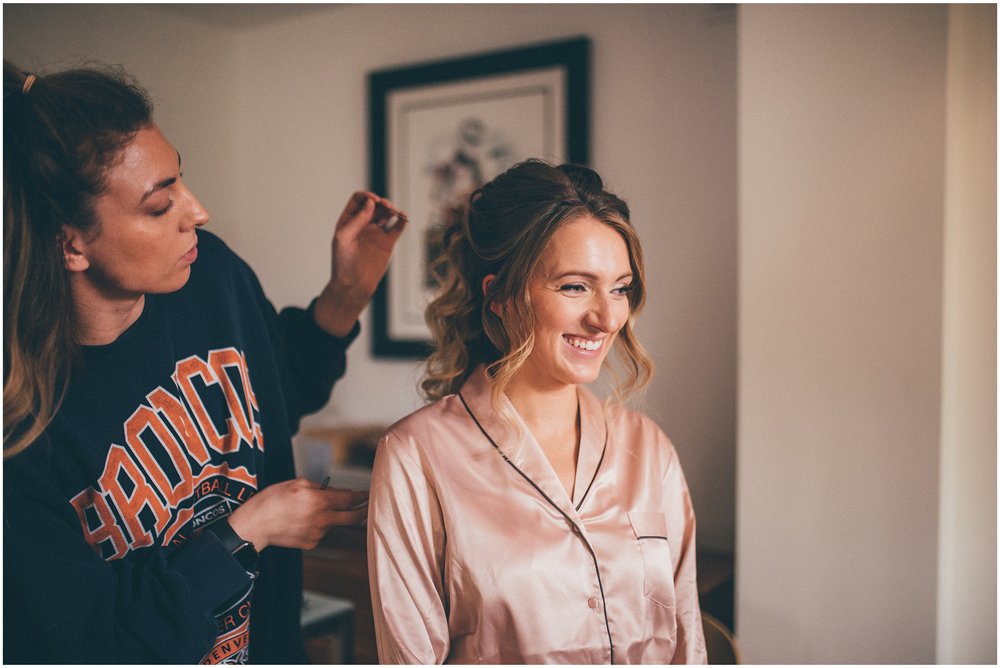 Bridesmaid gets her hair done before the Liverpool Wedding at Sefton Palm House
