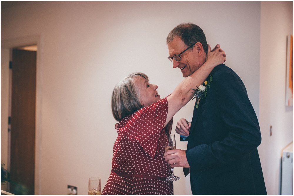 Mother of the bride and father of the bride embrace in Liverpool Wedding