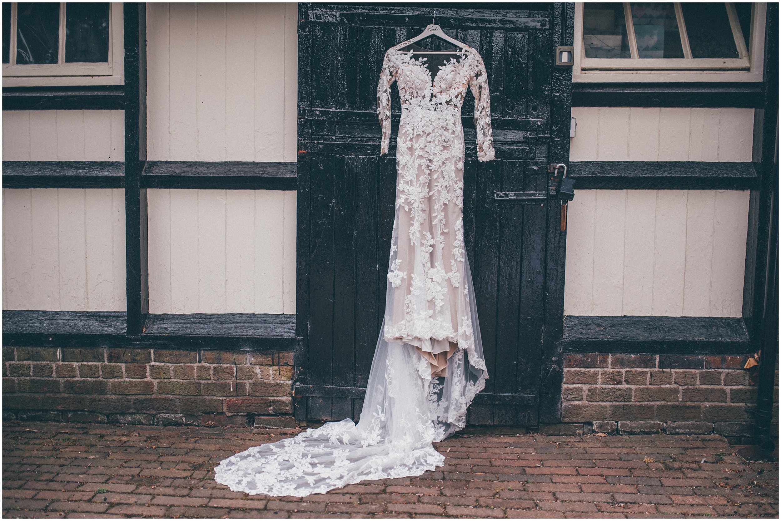 Brides beautiful wedding dress hung up at Abbeywood Estate in Delamere, Cheshire