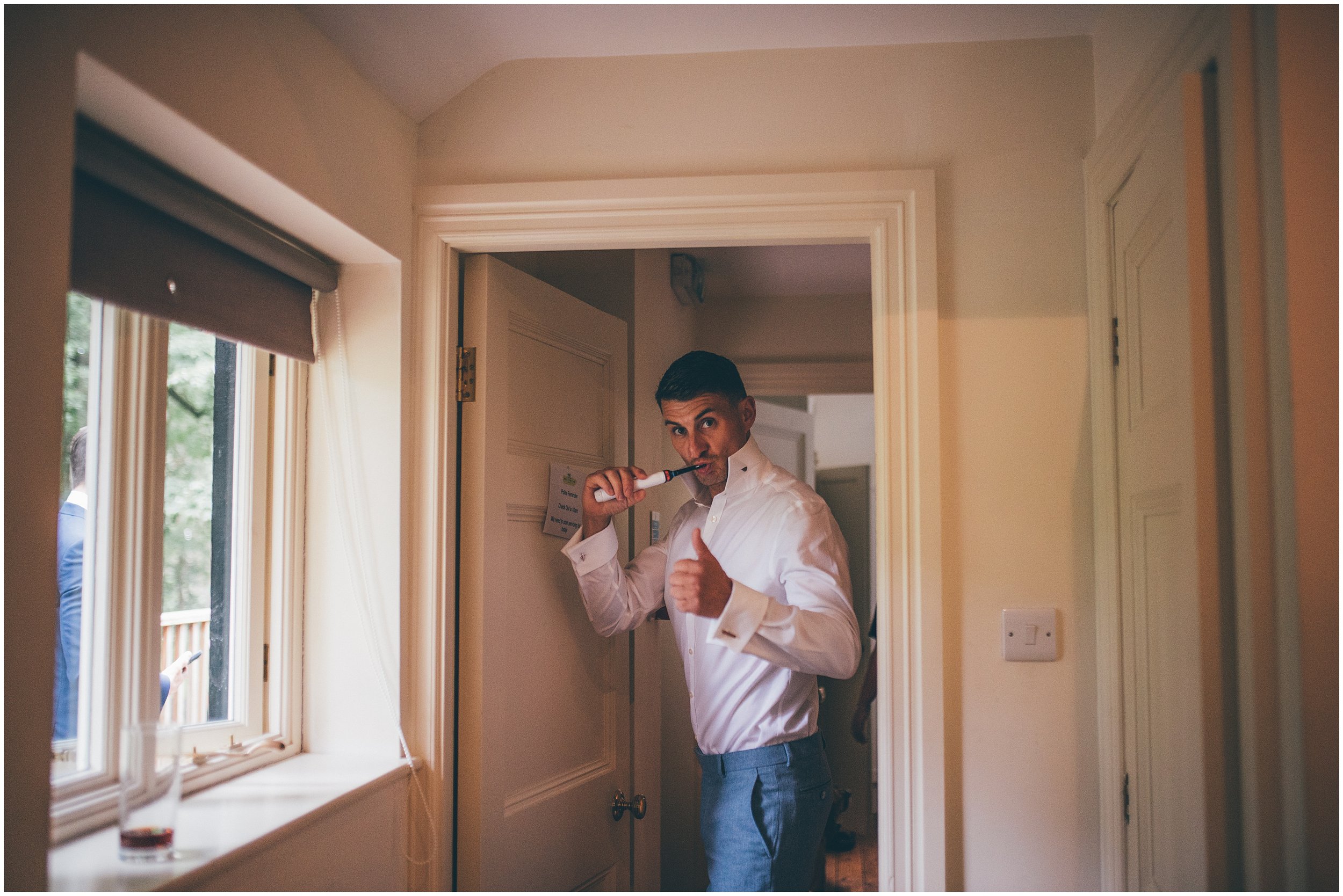 Groom gets ready at Abbeywood Estate wedding venue in Delamere, Cheshire