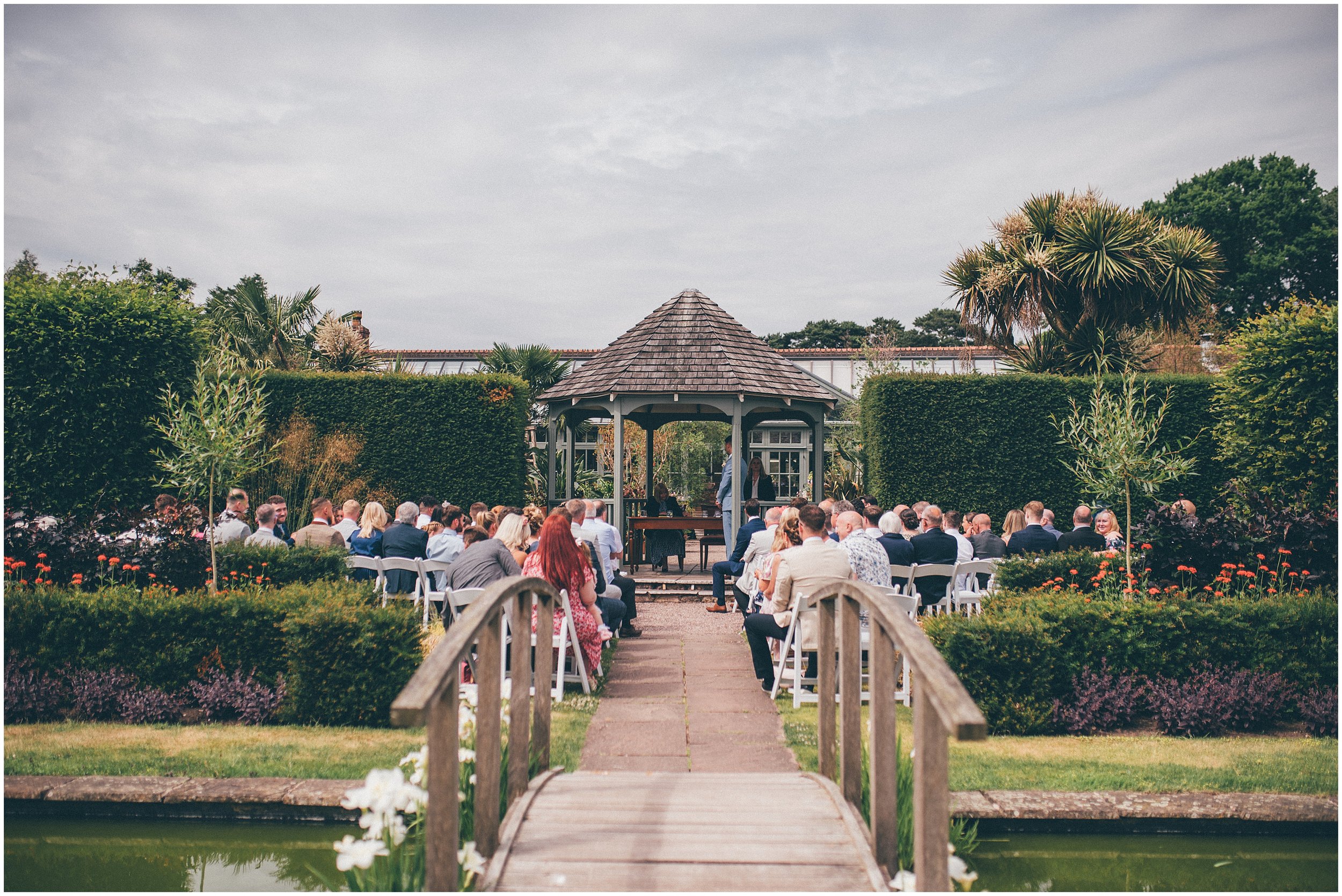 Outdoor wedding ceremony in the gardens at Abbeywood Estate in Delamere, Cheshire