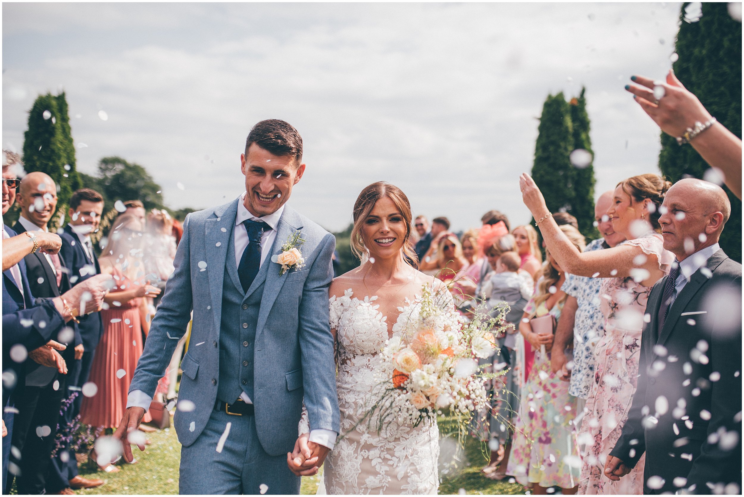 Bride and groom have an outdoor wedding ceremony in Cheshire at Abbeywood Estate wedding venue in Delamere.