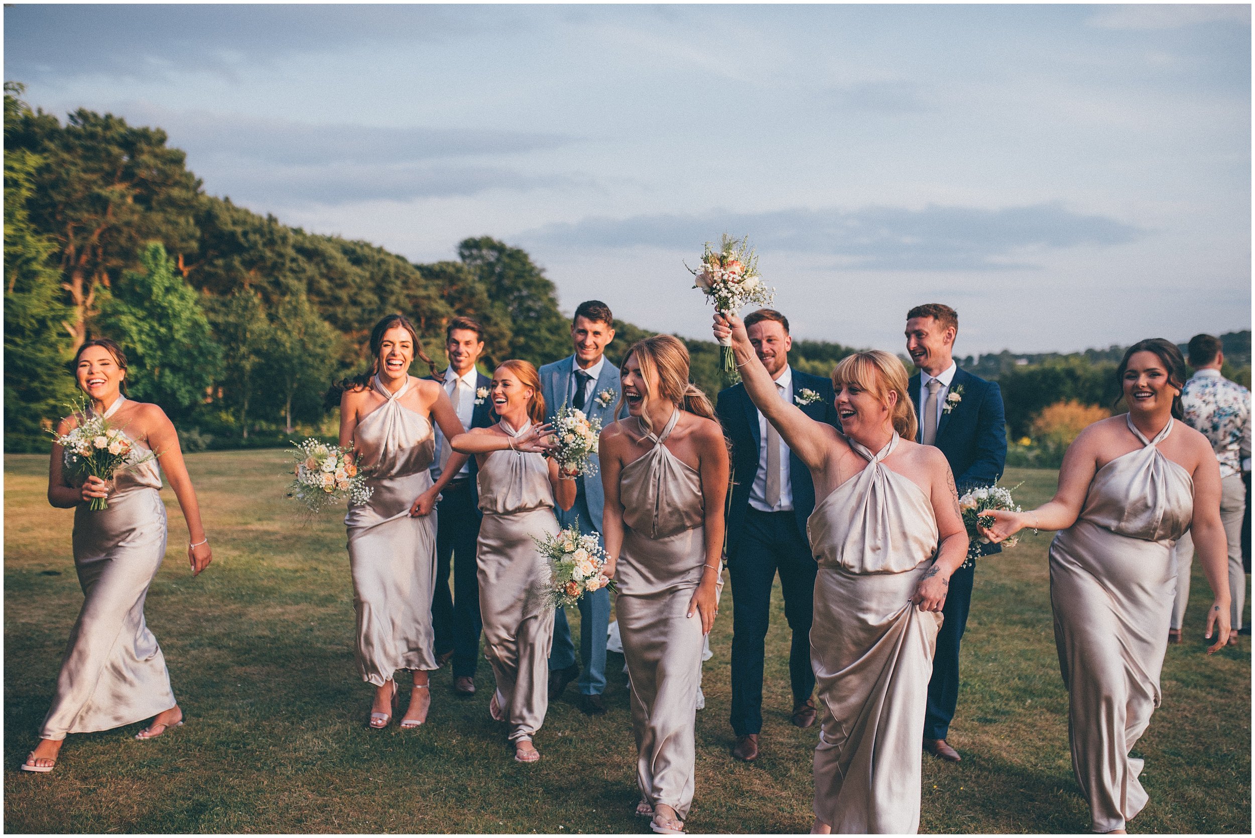 Bridal party enjoy golden hour at Abbeywood Estate wedding venue in Delamere, Cheshire.