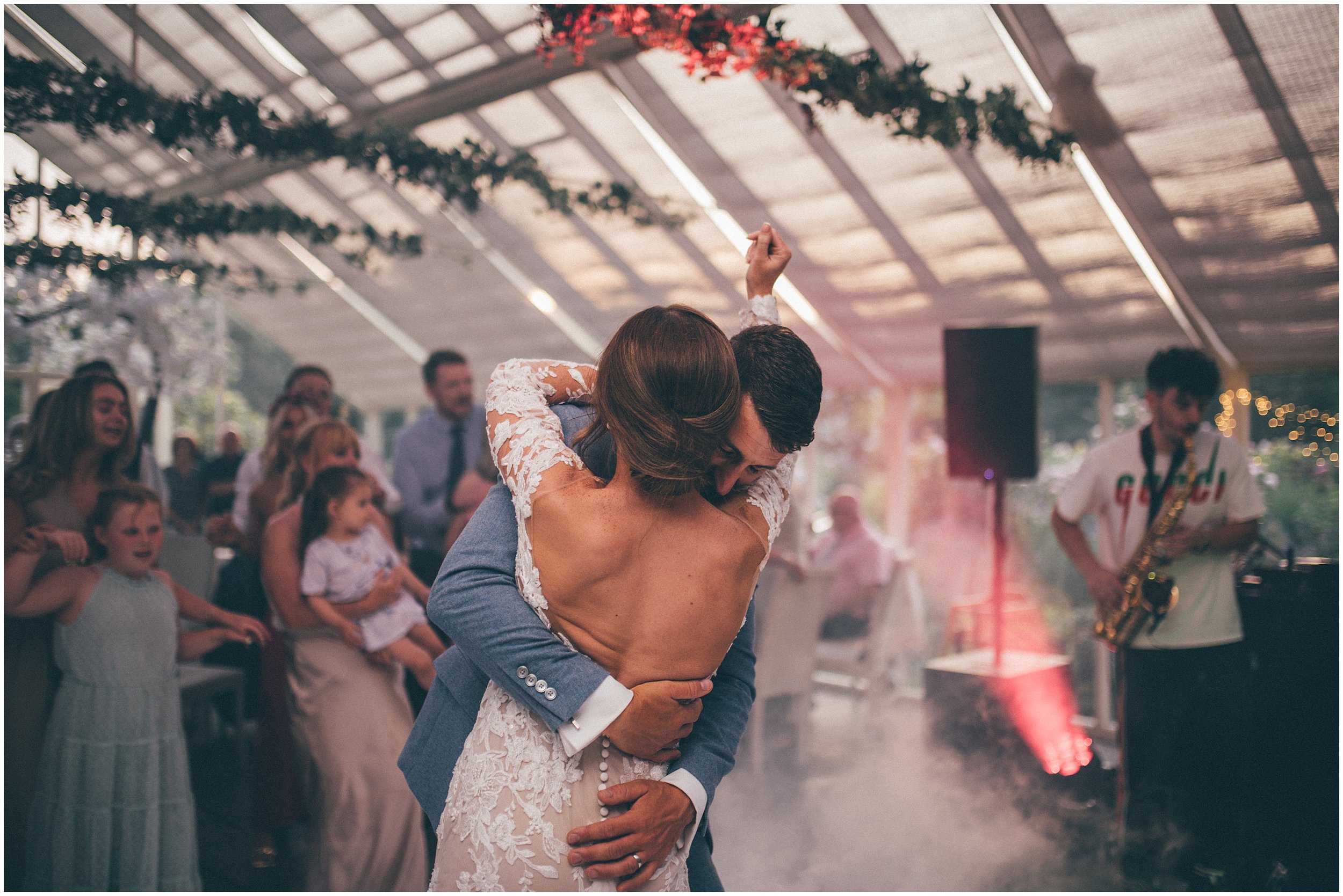 Bride and groom enjoy the dancefloor during their First Dance at Abbeywood Estate wedding venue in Delamere, Cheshire.