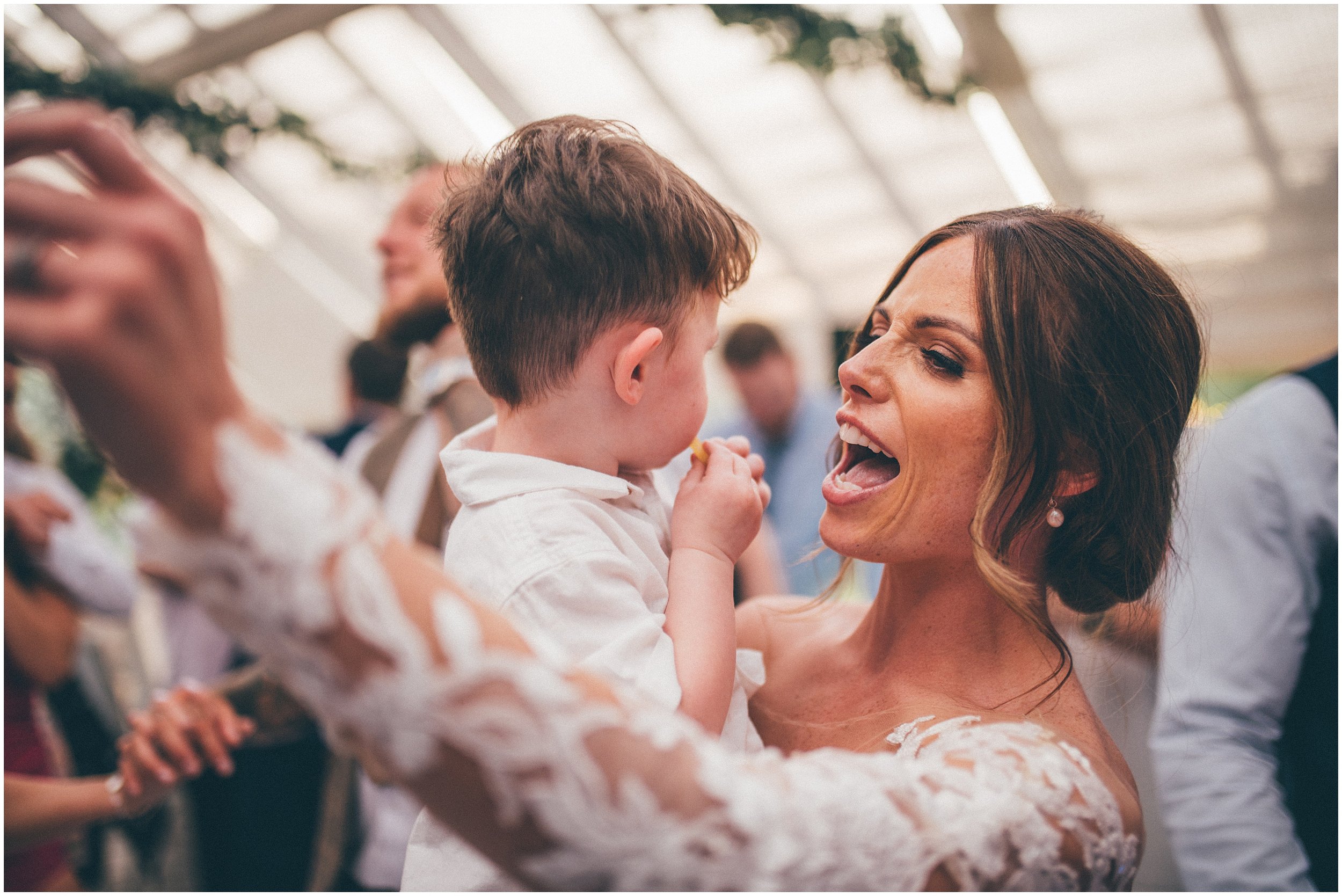 Wedding Guests enjoy the dancefloor at Abbeywood Estate wedding venue in Delamere, Cheshire.