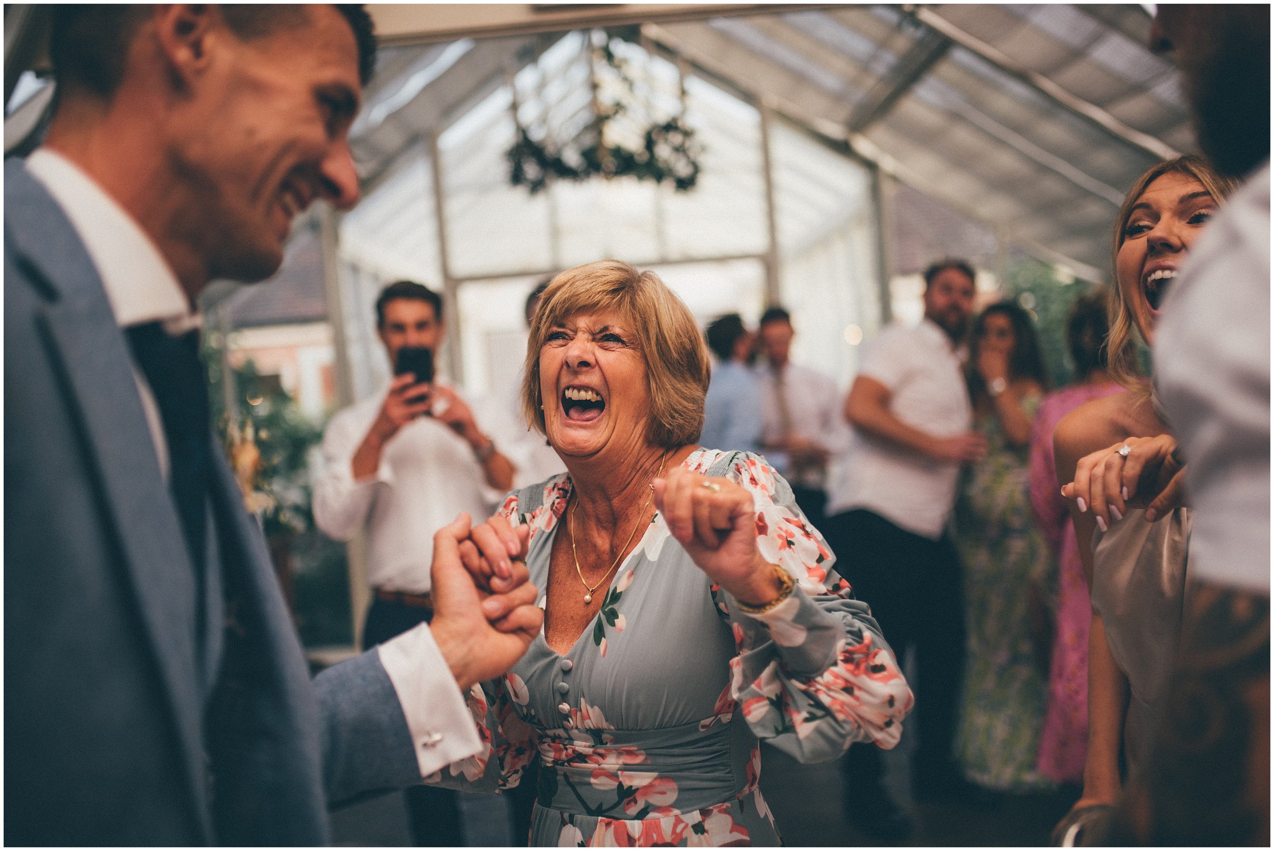 Wedding Guests enjoy the dancefloor at Abbeywood Estate wedding venue in Delamere, Cheshire.